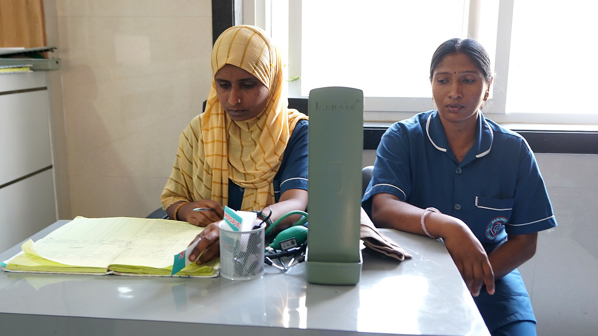Sanjeevi doctors reviewing a patient chart