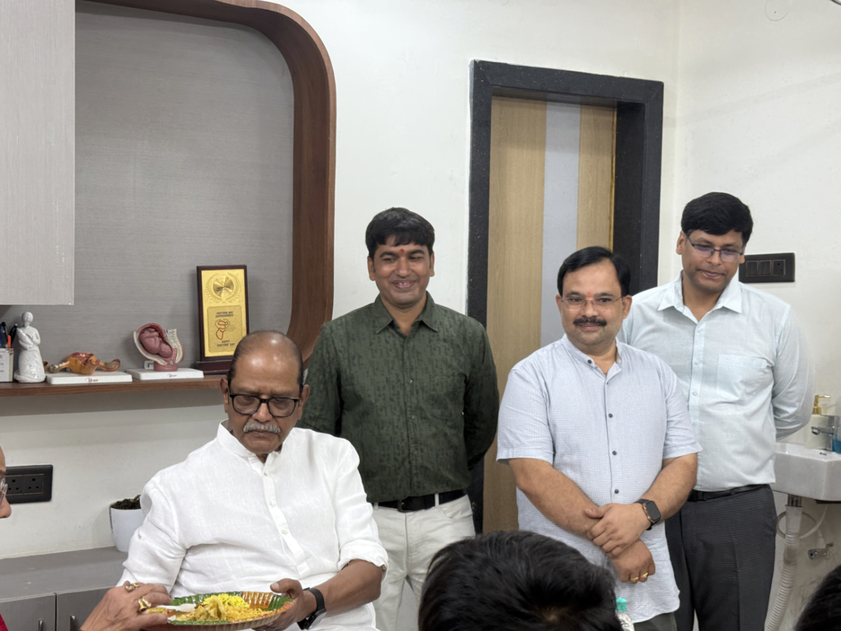 Visitors and doctors gathered inside a consultation space at Sanjeevi Hospital.